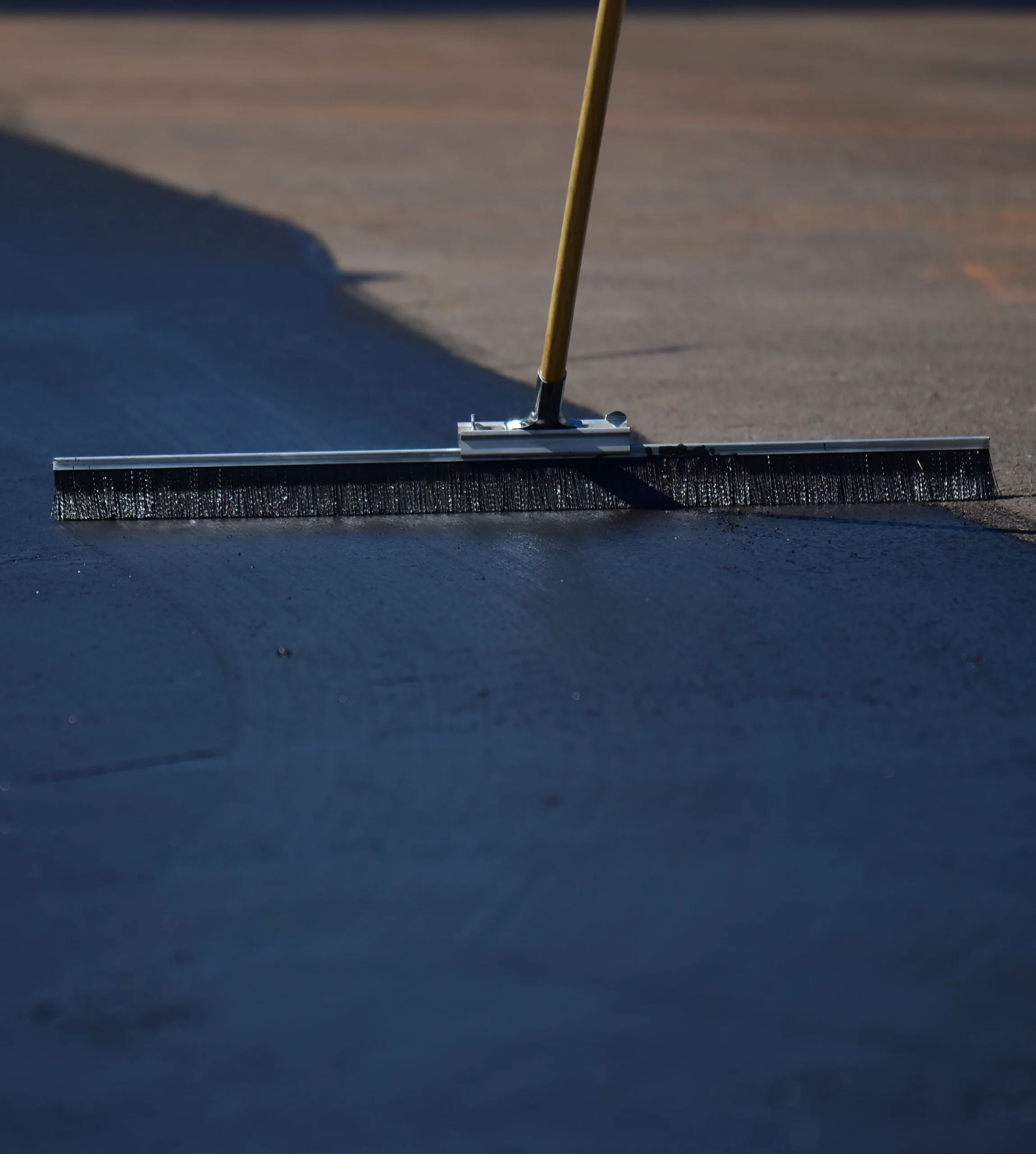 Brushing new sealcoat